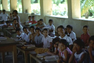 Sri Lankan children in a classroom. Artist: CM Dixon Artist: Unknown