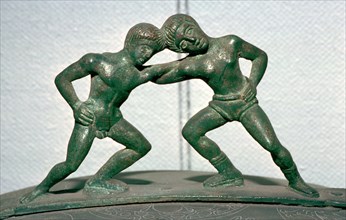 Etruscan bronze handle of a cista, showing Peleus and Thetis wrestling. Artist: Unknown