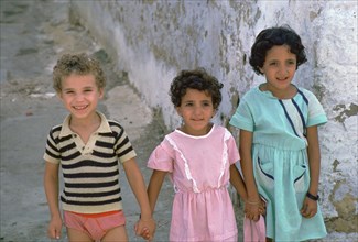 Three children in Kairouan, Tunisia. Artist: Unknown