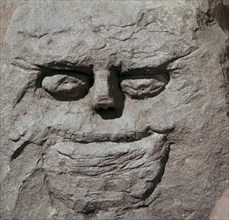 Stone head from a pagan Celtic shrine. Artist: Unknown