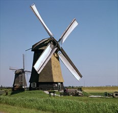 Windmills in Holland. Artist: Unknown