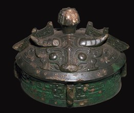 Chinese bronze lid of a wine-vessel, 11th century BC.h Artist: Unknown