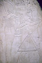 Egyptian relief of Amon making an offering to Osiris. Artist: Unknown