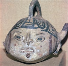 Huaxtec culture spouted jug painted with a human face. Artist: Unknown