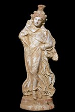 Greek terracotta of a woman in a flowing dress. Artist: Unknown