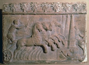 Roman terracotta panel showing a racing chariot. Artist: Unknown