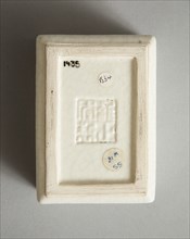 Soft paste rectangular vessel with characters in relief, early 19th century. Artist: Unknown.