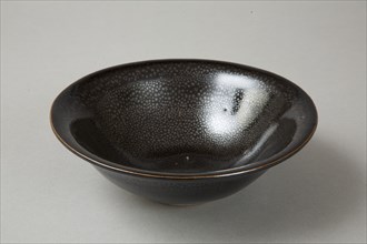 A 20th century copy of buff-bodied Cizhou-type bowl with oil spot glaze, 20th century. Artist: Unknown.