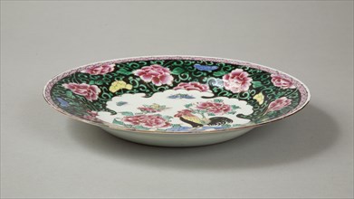 European copy of famille noire plate with cockerel looking at a butterfly, 20th century. Artist: Unknown.
