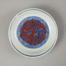 Red clobbered blue and white saucer with stork, phoenix and dragons, Jiajing (1522-1566). Artist: Unknown.