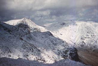 Scafell and Scafell Pike in Winter, English Lake District, Cumbria, 20th century. Artist: CM Dixon.