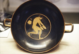 Athlete with Jumping-Weight, detail of Greek Kylix, (drinking-cup), c6th century BC.
