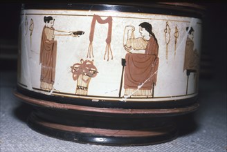 Greek Pyxis, (Cosmetic Box), Women performing domestic tasks, Athens, c460BC-450 BC. Artist: Unknown.