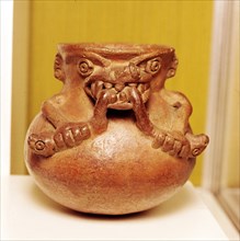 Pottery Bowl of an alligator with human arms devouring snakes, Chiriqui, Panama. Artist: Unknown.