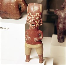 Pottery Figure of standing woman, face painted with fret pattern, Guanajuato, Mexico, 2000BC-300. Artist: Unknown.