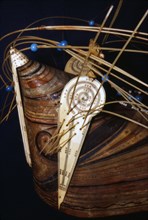Inuit Wood hunting cap with ivory ornament collected during Cooks 3rd voyage, 1776-1780. Artist: Unknown.