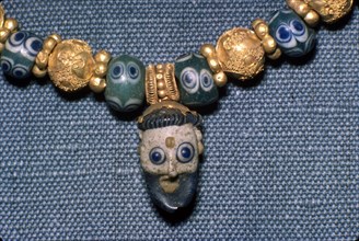 Phoenician glass head on Etruscan Necklace, c7th century BC. Artist: Unknown.