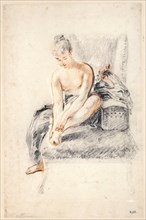 'Young woman, nude, holding one foot in her hands', 1716-18.  Artist: Jean-Antoine Watteau
