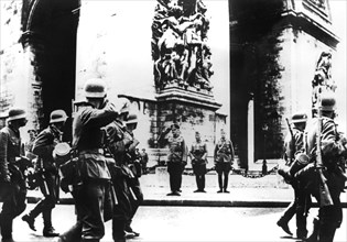 German troops marching past the Arc de Triomphe, Paris, 14 June 1940. Artist: Unknown