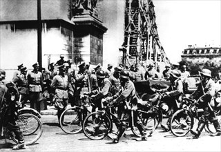 German soldiers marching past the Arc de Triomphe, Paris, 14 June 1940. Artist: Unknown