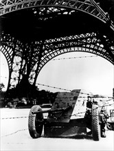 Barbed wire and anti-tank gun beneath the Eiffel Tower, German-occupied Paris, 1940-1944. Artist: Unknown