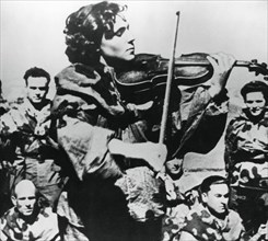 Russian army nurse playing a violin, Eastern Front, 1944. Artist: Unknown