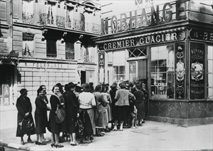 Queue of women outside a dairy shop, German-occupied Paris, 28 June 1940. Artist: Unknown
