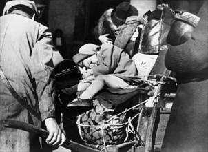 Refugees with their luggage at the Gare de l'Est, Paris, August 1940. Artist: Unknown