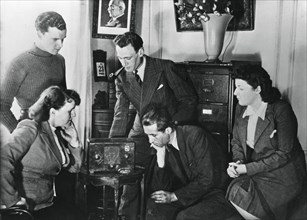French citizens listening to a broadcast by Vichy deputy premier Admiral Darlan, 23 May, 1941. Artist: Unknown