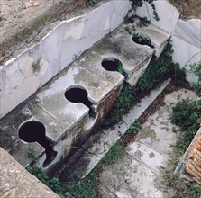 Roman toilet, Ostia, Italy. Artist: Unknown