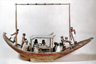 Ancient Egyptian model of a boat carrying a mummy to its tomb. Artist: Unknown
