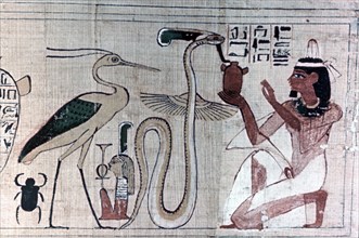Ancient Egyptian papyrus of death kneeling before a snake. Artist: Unknown