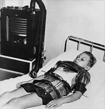Eleven yeat old boy in an iron lung, Beaujon Hospital, Paris, c1947-1951 Artist: Unknown