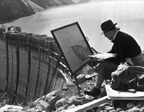 A artist from Linz painting the Limberg Dam, Austria, c1947-1951. Artist: Unknown