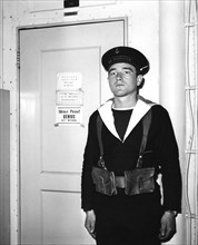 A French sentry outside the operations room of the aircraft carrier 'La Fayette', 1951. Artist: Unknown