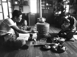Family relaxing in their living-room, Hokkaido region, Japan, 1963. Artist: Unknown