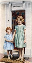 The Princesses Elizabeth and Margaret Rose at the door of the Little House, 1933, (c1935). Artist: Unknown