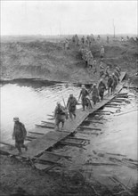 German prisoners on a duckboard track at the Yser Canal, Belgium, 31 July 1917. Artist: Unknown