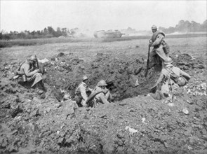 French infantry resting in a shell hole, Chemin des Dames, France, 11 June 1918. Artist: Unknown