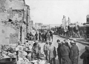 Captive German prisoners removing debris from the streets of Clermont-en-Argonne, France, 1914. Artist: Unknown