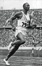 Jesse Owens at the end of the 100m at the Berlin Olympic Games, 1936. Artist: Unknown