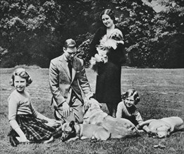 Royal family as a happy group of dog lovers, 1937.Artist: Michael Chance