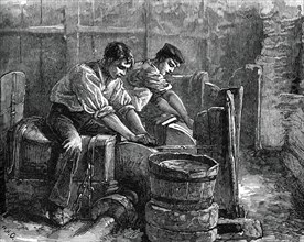 Grinders at work on a wheel, c1880. Artist: Unknown