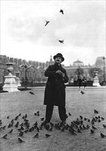 A bird charmer, Paris, 1931.Artist: Ernest Flammarion