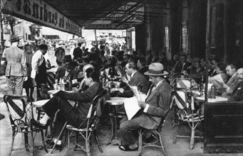 People at a pavement cafe, Paris, 1931.Artist: Ernest Flammarion