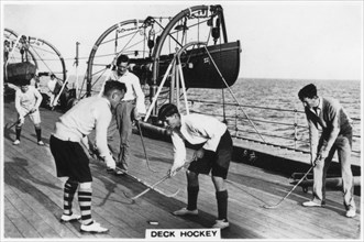 Deck hockey on board the battleship HMS 'Nelson', 1937. Artist: Unknown