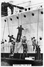Painting the hull of a ship, 1937. Artist: Unknown