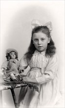 A young girl holding a doll, 20th century. Artist: Unknown