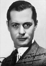 Robert Montgomery (1904-1981), American actor and director, c1930s-c1940s. Signed photograph. Artist: Unknown