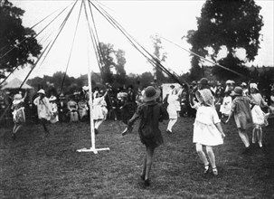 Children dancing round a maypole, 1926. Artist: Unknown